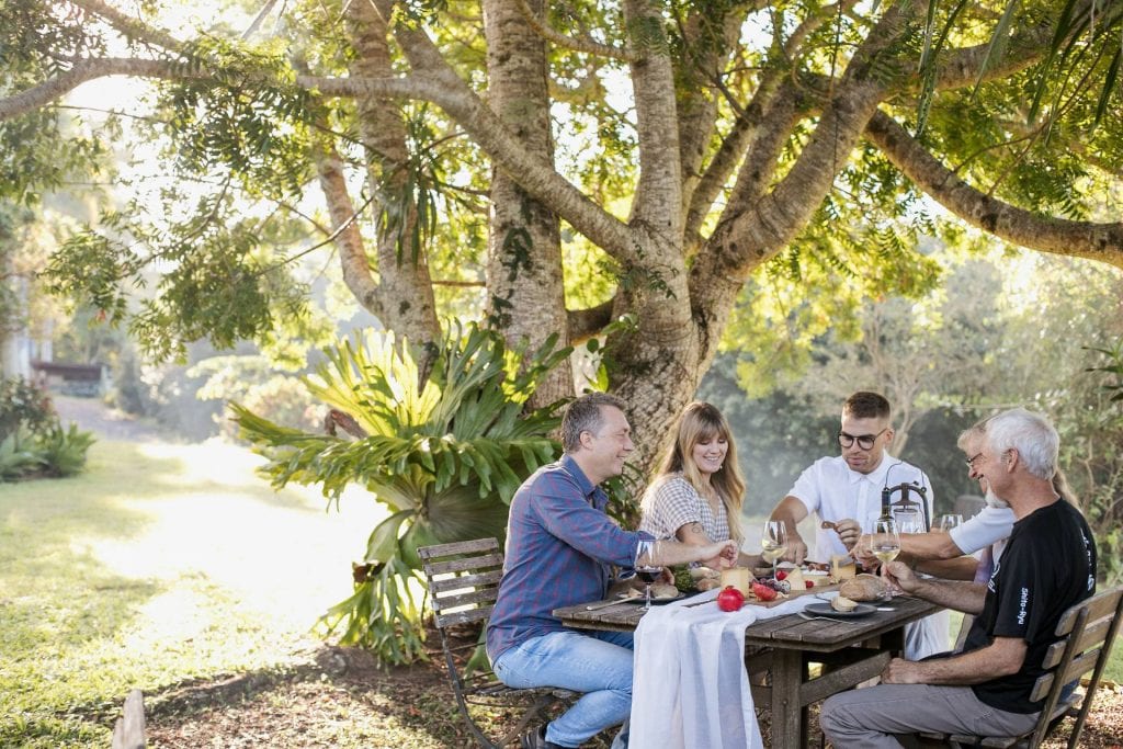 Fromart farm picnic table with group eating cheese